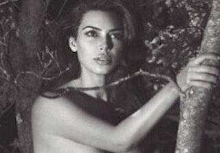 Kim Kardashian Poses In Nothing But Boots